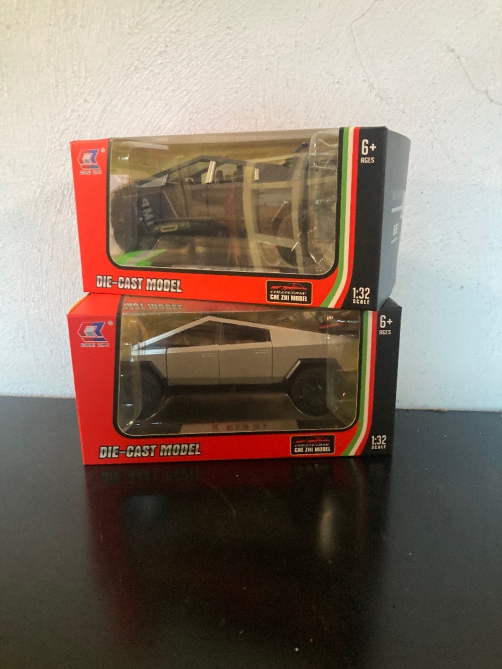 Set of two toy cars in boxes. Tesla cars, Wind up action, flashing lights!!